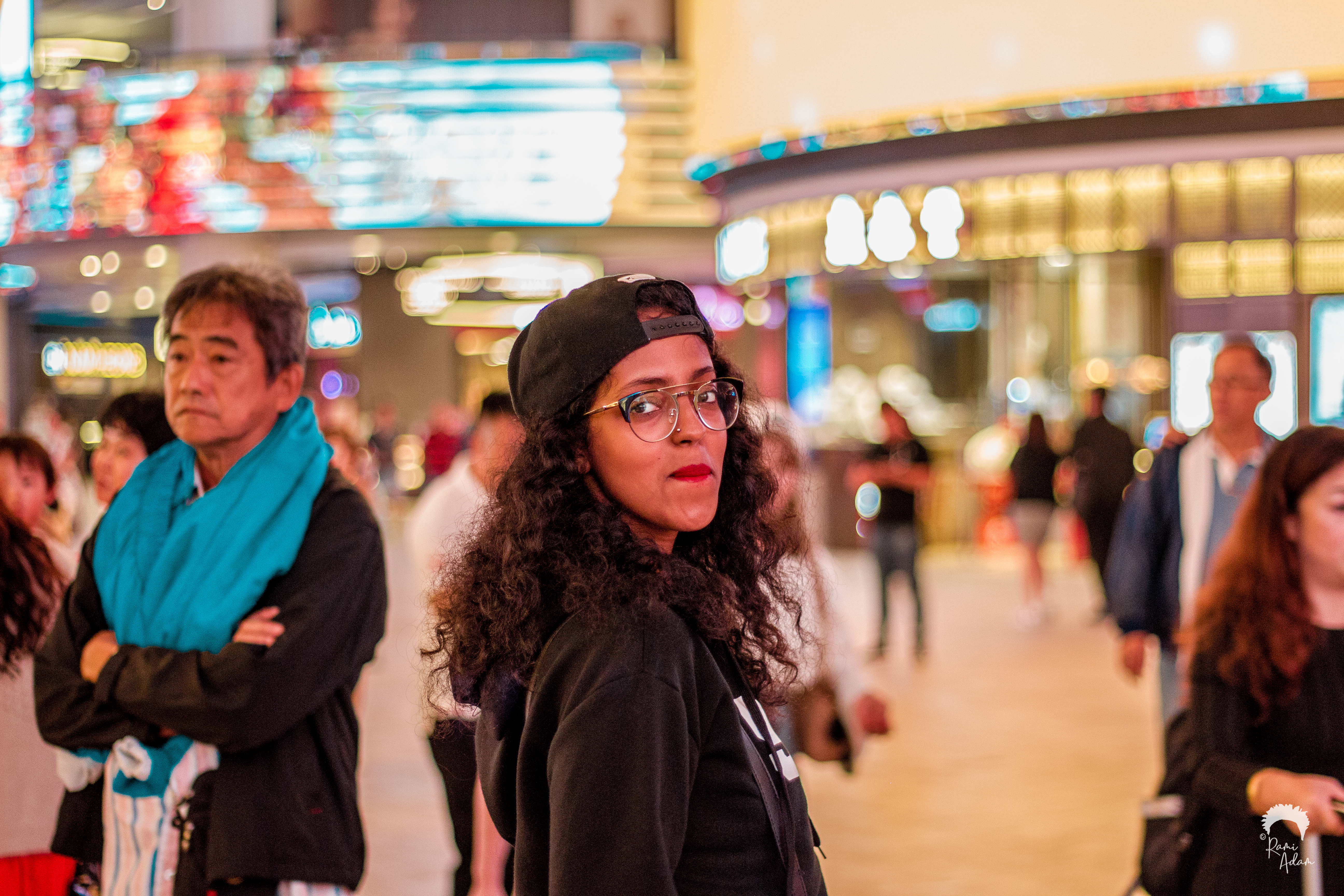 Woman looking back in night city